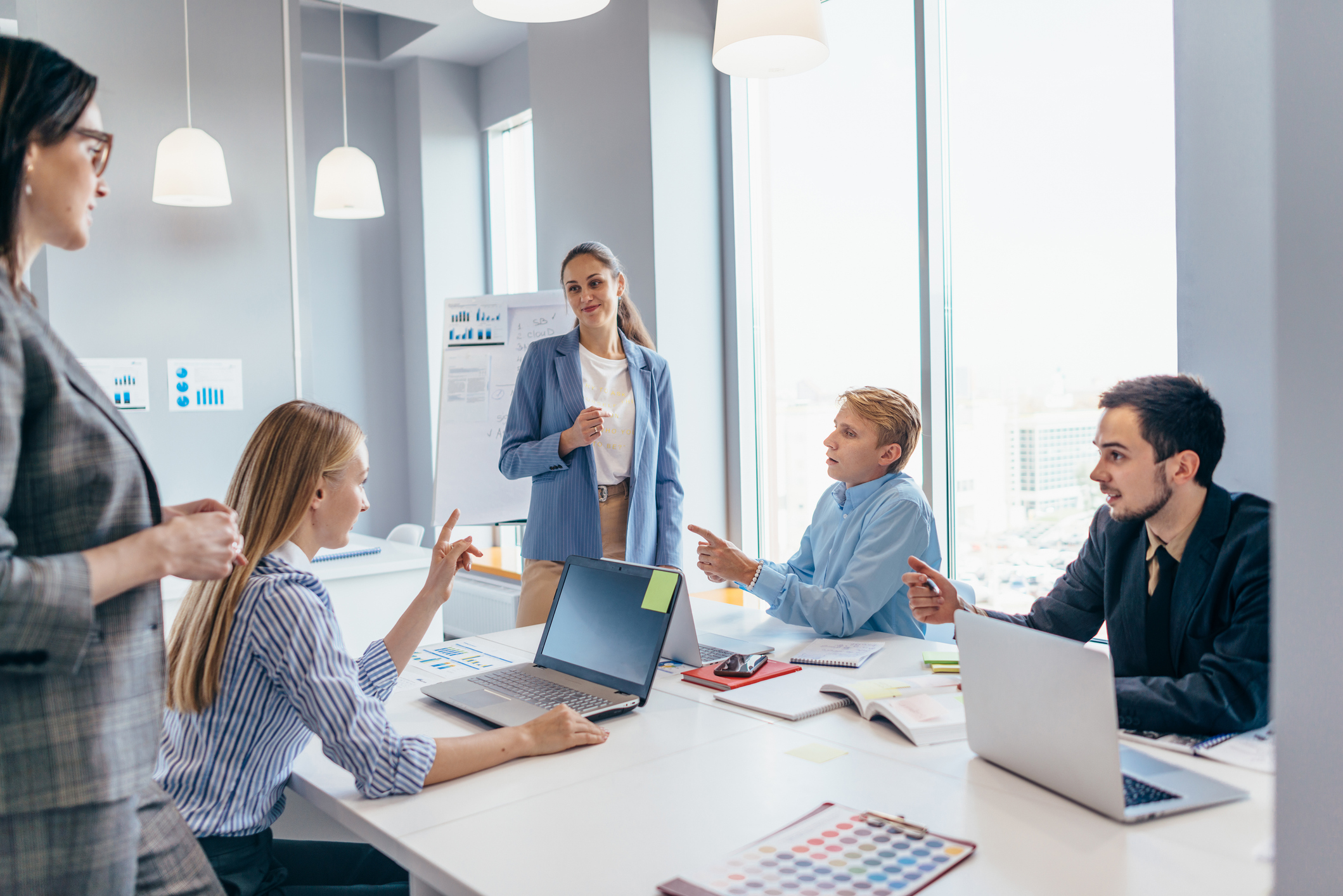 A group of colleagues working together in the office