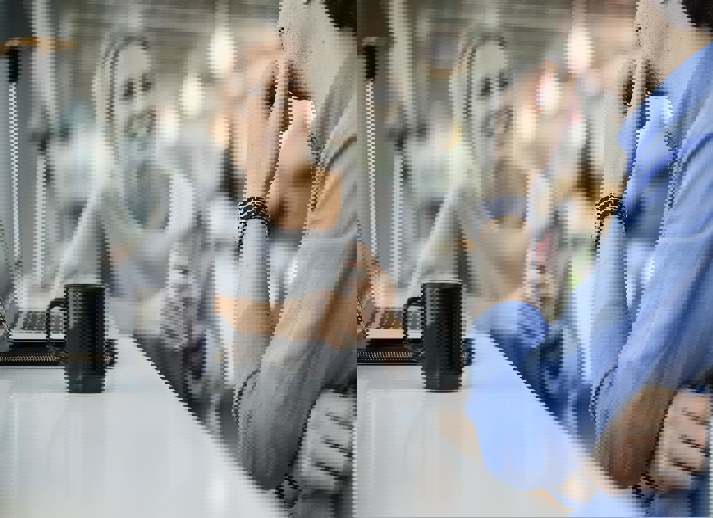 Two colleagues in a positive conversation, which symbolizes a constructive salary discussion with a late manager.